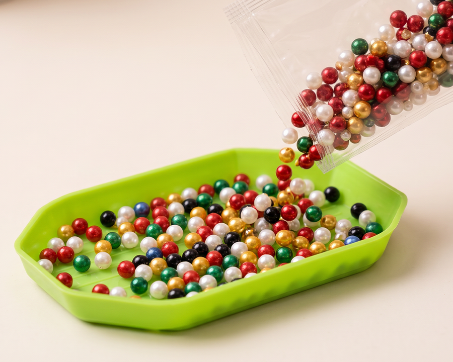 Pouring pearl beads into the sorting tray